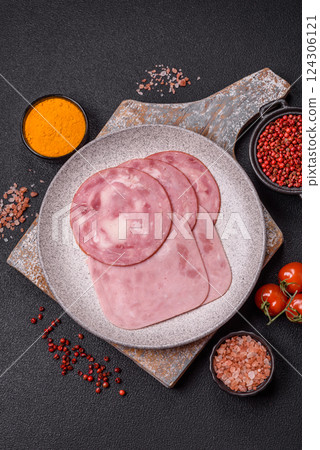 Boiled ham with salt and spices cut into slices Boiled ham with salt and spices cut into slices 124306121