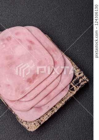 Boiled ham with salt and spices cut into slices Boiled ham with salt and spices cut into slices 124306130