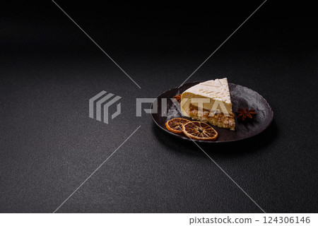 Piece of cheesecake with nuts and berries with winter pattern Piece of cheesecake with nuts and berries with winter pattern 124306146