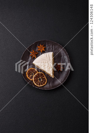 Piece of cheesecake with nuts and berries with winter pattern Piece of cheesecake with nuts and berries with winter pattern 124306148