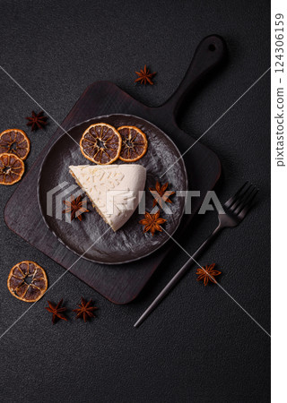 Piece of cheesecake with nuts and berries with winter pattern 124306159