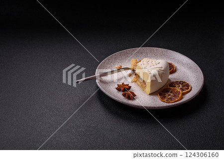 Piece of cheesecake with nuts and berries with winter pattern 124306160