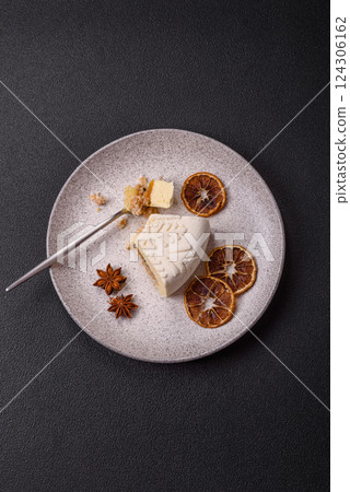 Piece of cheesecake with nuts and berries with winter pattern 124306162