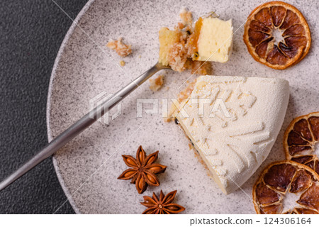 Piece of cheesecake with nuts and berries with winter pattern Piece of cheesecake with nuts and berries with winter pattern 124306164