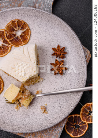 Piece of cheesecake with nuts and berries with winter pattern Piece of cheesecake with nuts and berries with winter pattern 124306168