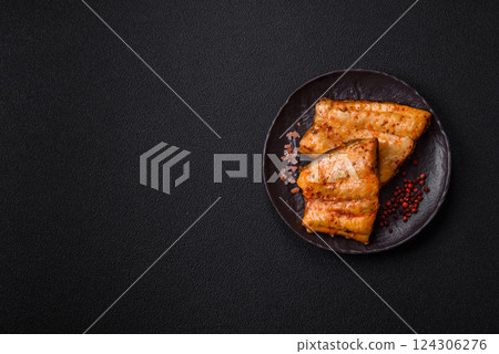 Grilled fish fillet with salt, spices and herbs 124306276