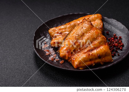 Grilled fish fillet with salt, spices and herbs Grilled fish fillet with salt, spices and herbs 124306278