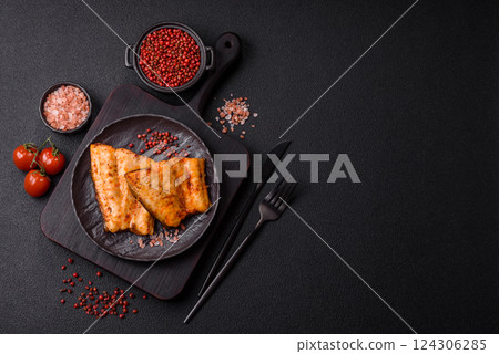 Grilled fish fillet with salt, spices and herbs Grilled fish fillet with salt, spices and herbs 124306285