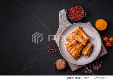 Grilled fish fillet with salt, spices and herbs 124306300