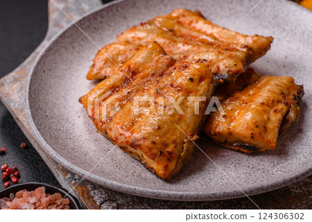 Grilled fish fillet with salt, spices and herbs 124306302