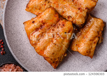 Grilled fish fillet with salt, spices and herbs Grilled fish fillet with salt, spices and herbs 124306303