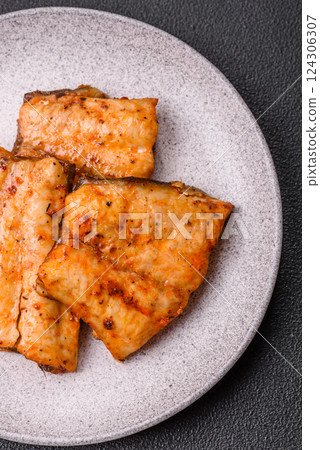 Grilled fish fillet with salt, spices and herbs 124306307
