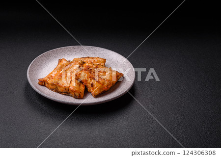 Grilled fish fillet with salt, spices and herbs 124306308