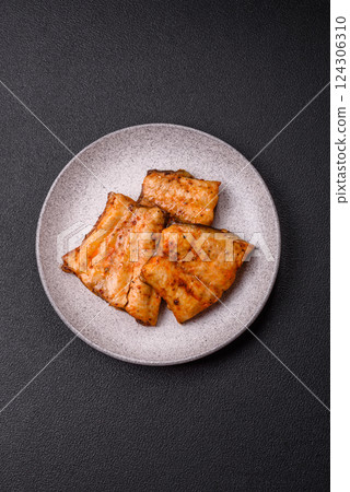 Grilled fish fillet with salt, spices and herbs 124306310