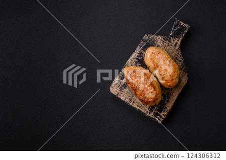 Delicious fresh fried minced fish cutlets with spices and herbs 124306312