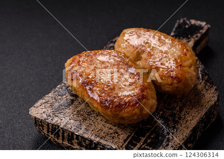 Delicious fresh fried minced fish cutlets with spices and herbs 124306314