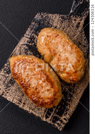Delicious fresh fried minced fish cutlets with spices and herbs Delicious fresh fried minced fish cutlets with spices and herbs 124306316