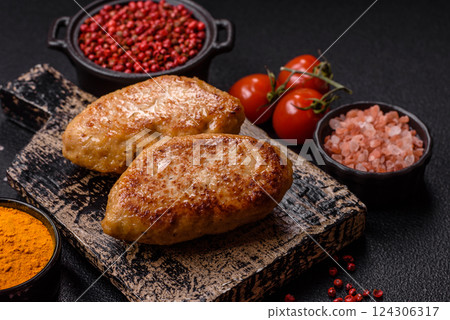 Delicious fresh fried minced fish cutlets with spices and herbs Delicious fresh fried minced fish cutlets with spices and herbs 124306317