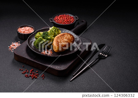 Delicious fresh green broccoli steamed in a ceramic plate 124306332