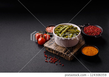 Steamed green beans on a plate with olive oil, sesame seeds Steamed green beans on a plate with olive oil, sesame seeds 124306359