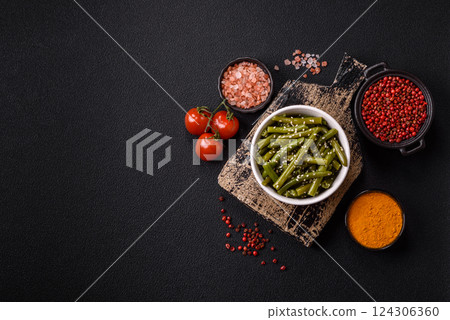 Steamed green beans on a plate with olive oil, sesame seeds 124306360