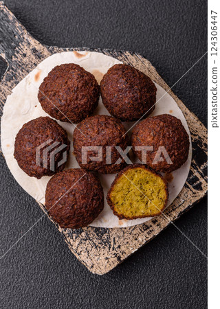 Fried chickpea falafel balls with salt, spices and herbs 124306447