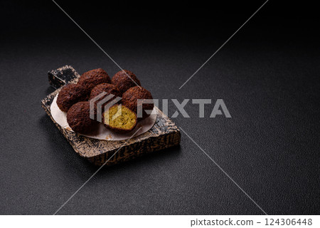 Fried chickpea falafel balls with salt, spices and herbs 124306448