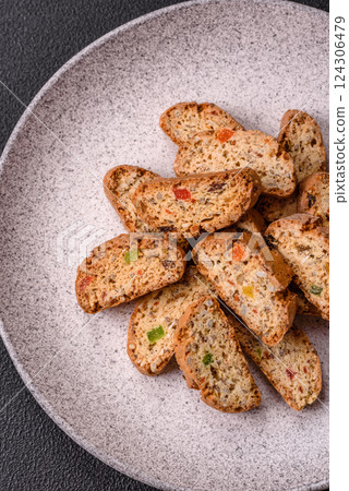 Freshly baked Italian cantuccini cookies with nuts and candied fruits Freshly baked Italian cantuccini cookies with nuts and candied fruits 124306479