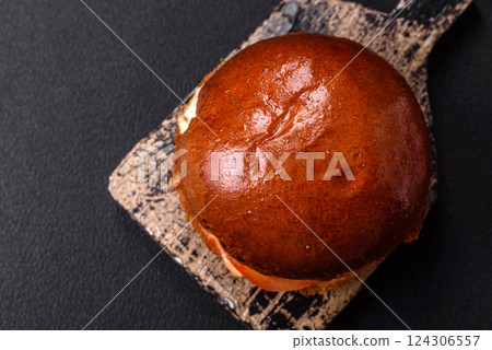 Delicious burger with beef patty, fried egg, bacon, herbs, sauce, salt and spices Delicious burger with beef patty, fried egg, bacon, herbs, sauce, salt and spices 124306557