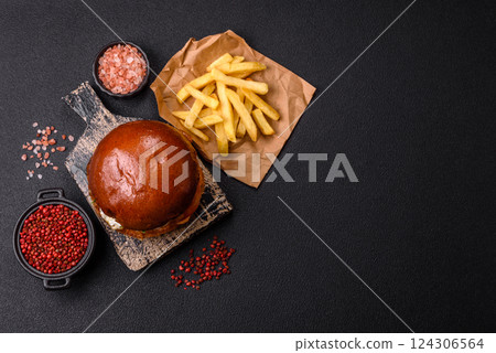 Delicious burger with beef patty, fried egg, bacon, herbs, sauce, salt and spices Delicious burger with beef patty, fried egg, bacon, herbs, sauce, salt and spices 124306564