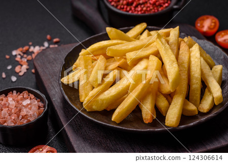 Delicious crispy French fries with salt and spices 124306614
