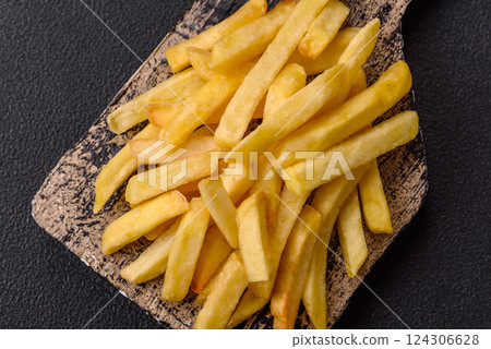Delicious crispy French fries with salt and spices Delicious crispy French fries with salt and spices 124306628