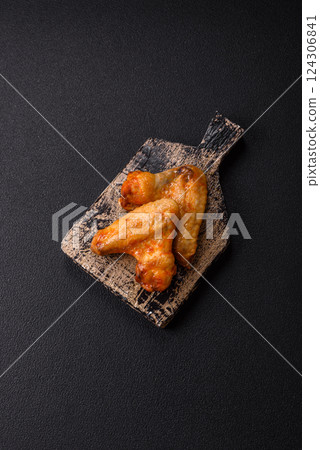 Grilled chicken wings with salt and spices Grilled chicken wings with salt and spices 124306841