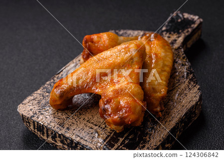 Grilled chicken wings with salt and spices Grilled chicken wings with salt and spices 124306842