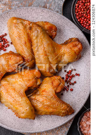 Grilled chicken wings with salt and spices 124306874