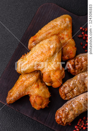 Grilled chicken wings with salt and spices 124306883