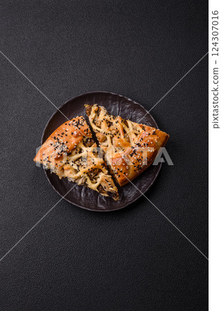 French quiche with chicken or salmon, cheese, salt, spices and herbs 124307016