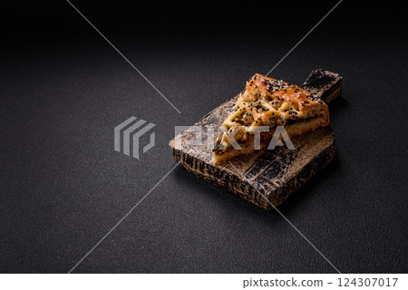 French quiche with chicken or salmon, cheese, salt, spices and herbs 124307017
