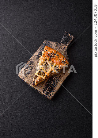 French quiche with chicken or salmon, cheese, salt, spices and herbs 124307019