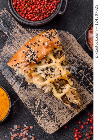 French quiche with chicken or salmon, cheese, salt, spices and herbs 124307025