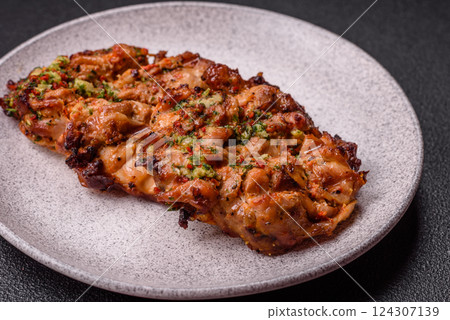 Grilled chicken fillet with garlic sauce, hot pepper 124307139