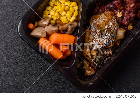 Grilled mackerel fillet pieces with vegetables, salt and spices Grilled mackerel fillet pieces with vegetables, salt and spices 124307202