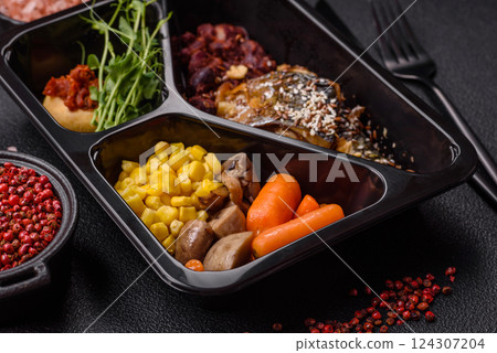 Grilled mackerel fillet pieces with vegetables, salt and spices 124307204