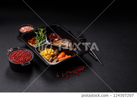 Grilled mackerel fillet pieces with vegetables, salt and spices 124307207