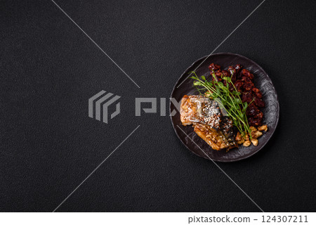 Grilled mackerel fillet pieces with vegetables, salt and spices 124307211