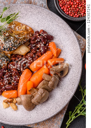 Grilled mackerel fillet pieces with vegetables, salt and spices 124307241