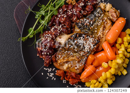 Grilled mackerel fillet pieces with vegetables, salt and spices Grilled mackerel fillet pieces with vegetables, salt and spices 124307249