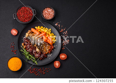 Grilled mackerel fillet pieces with vegetables, salt and spices Grilled mackerel fillet pieces with vegetables, salt and spices 124307255