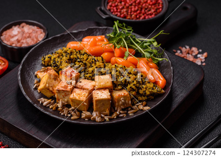 Quinoa bowl with tofu, steamed vegetables, grains, seeds and spices 124307274