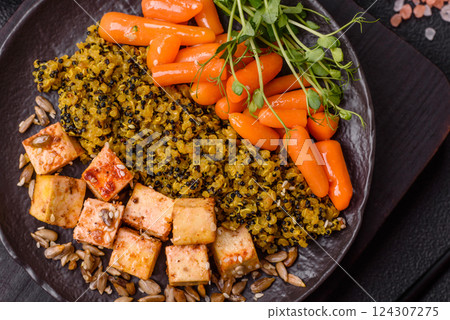 Quinoa bowl with tofu, steamed vegetables, grains, seeds and spices 124307275